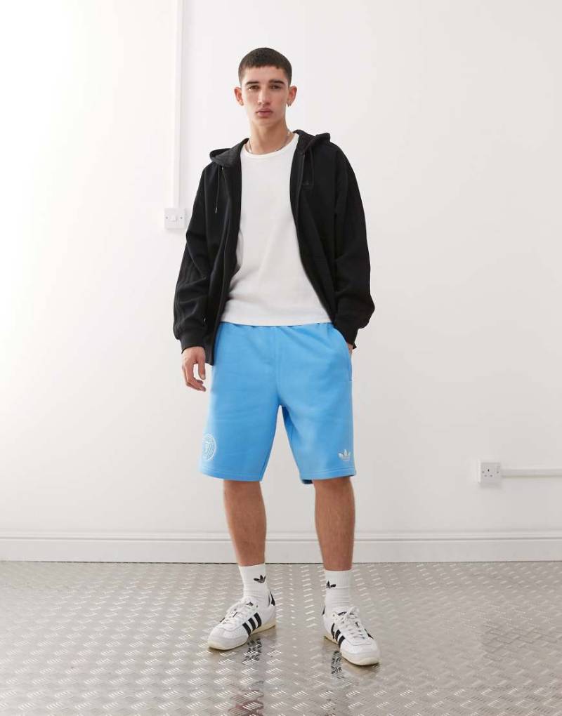 adidas Originals - Inter Miami - Shorts in Blau und Weiß adidas Originals - Inter Miami - Shorts in Blau und Weiß von adidas Originals