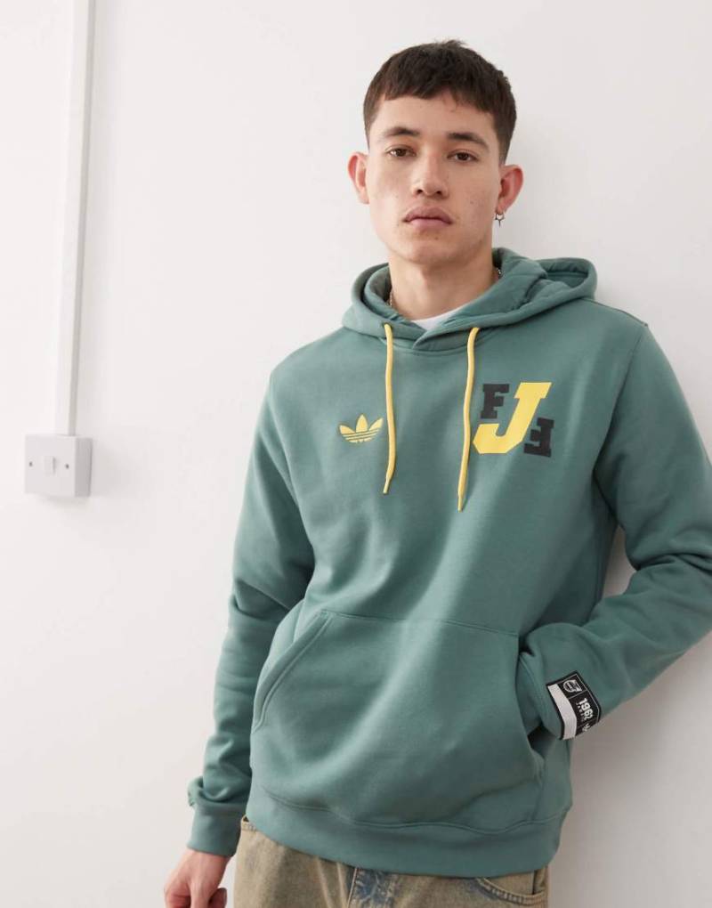 adidas Originals - Jamaica VRCT - Kapuzenpullover in Grün adidas Originals - Jamaica VRCT - Kapuzenpullover in Grün von adidas Originals