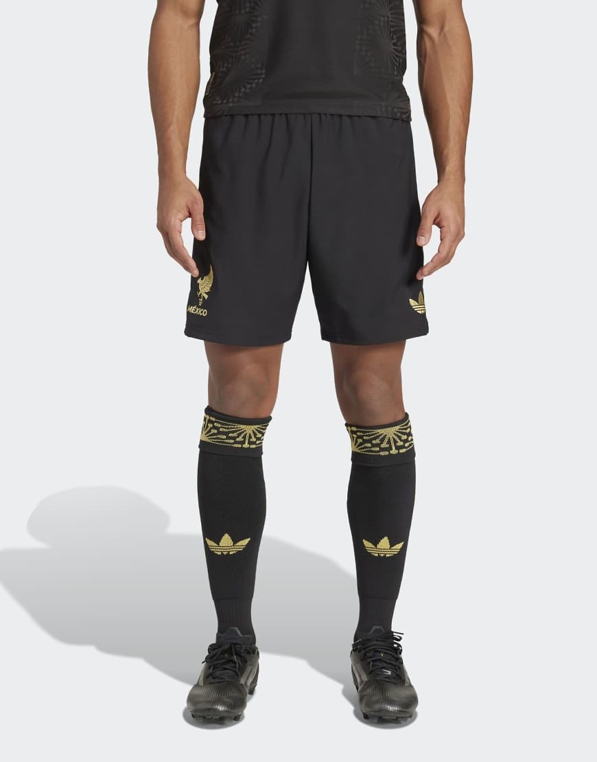 adidas Originals - Mexico 25 - Shorts in Schwarz und Gold adidas Originals - Mexico 25 - Shorts in Schwarz und Gold von adidas Originals