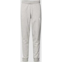 adidas Originals Sweatpants mit Logo-Stitching in Hellgrau Melange, Größe L von adidas Originals