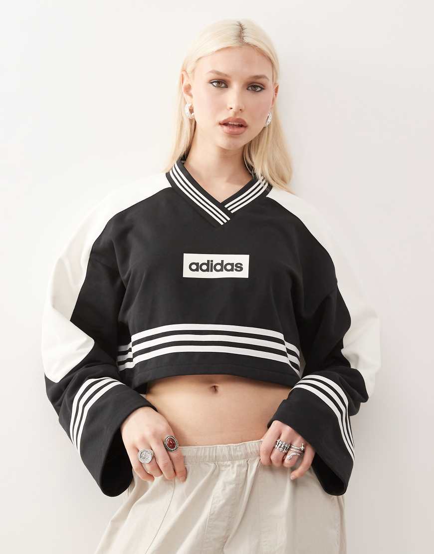 adidas Originals - Sweatshirts in Blockfarben-Design in Schwarz und Wollweiß mit Rundhalsausschnitt adidas Originals - Sweatshirts in Blockfarben-Design in Schwarz und Wollweiß mit Rundhalsausschnitt von adidas Originals