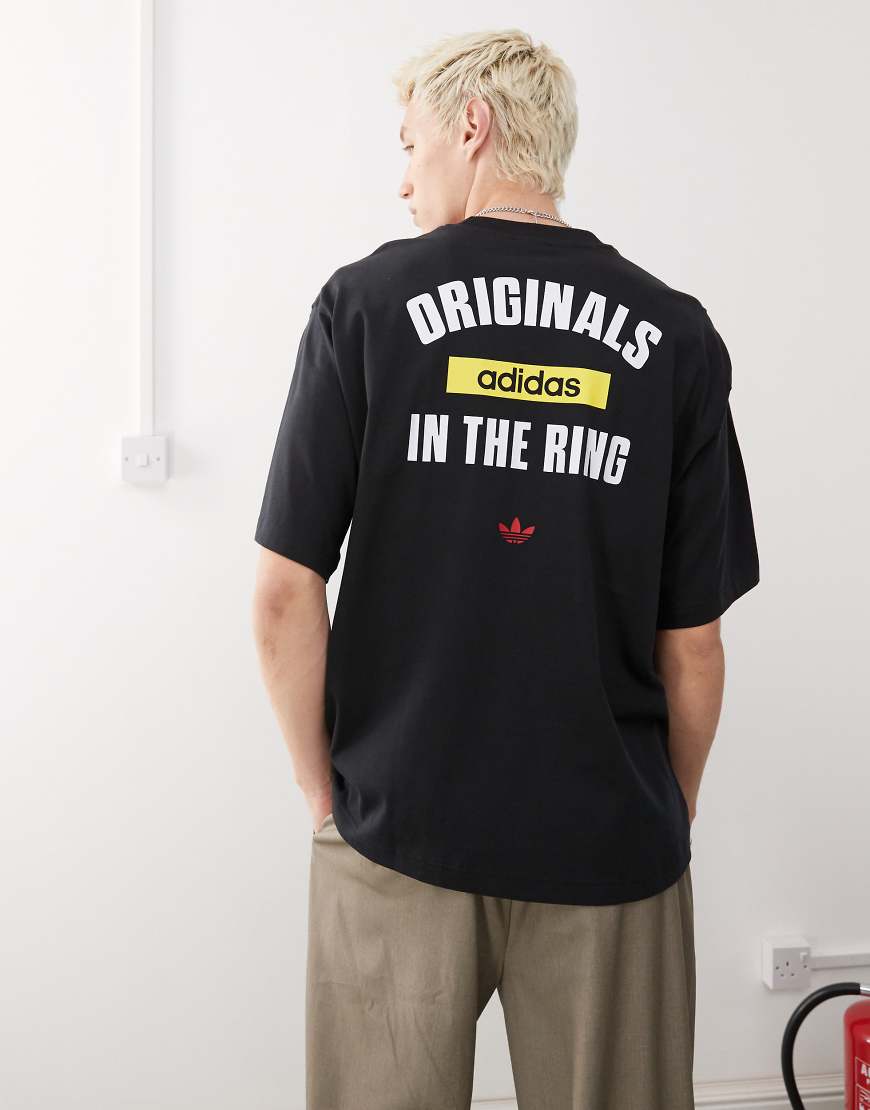 adidas Originals - T-Shirt mit „In The Ring"-Print-Schwarz adidas Originals - T-Shirt mit „In The Ring"-Print-Schwarz von adidas Originals