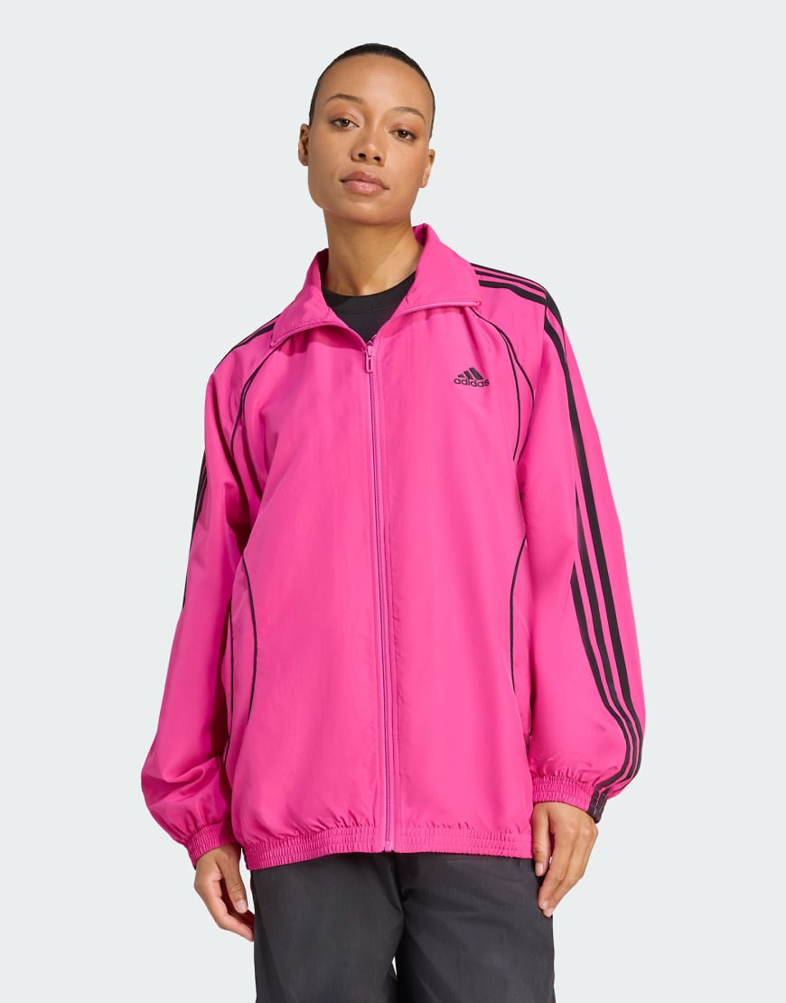 adidas Originals - Teamgeist adicolor - Oversize-Trainingsjacke aus Webstoff in Semi Lucid Fuchsia/Schwarz-Rosa von adidas Originals