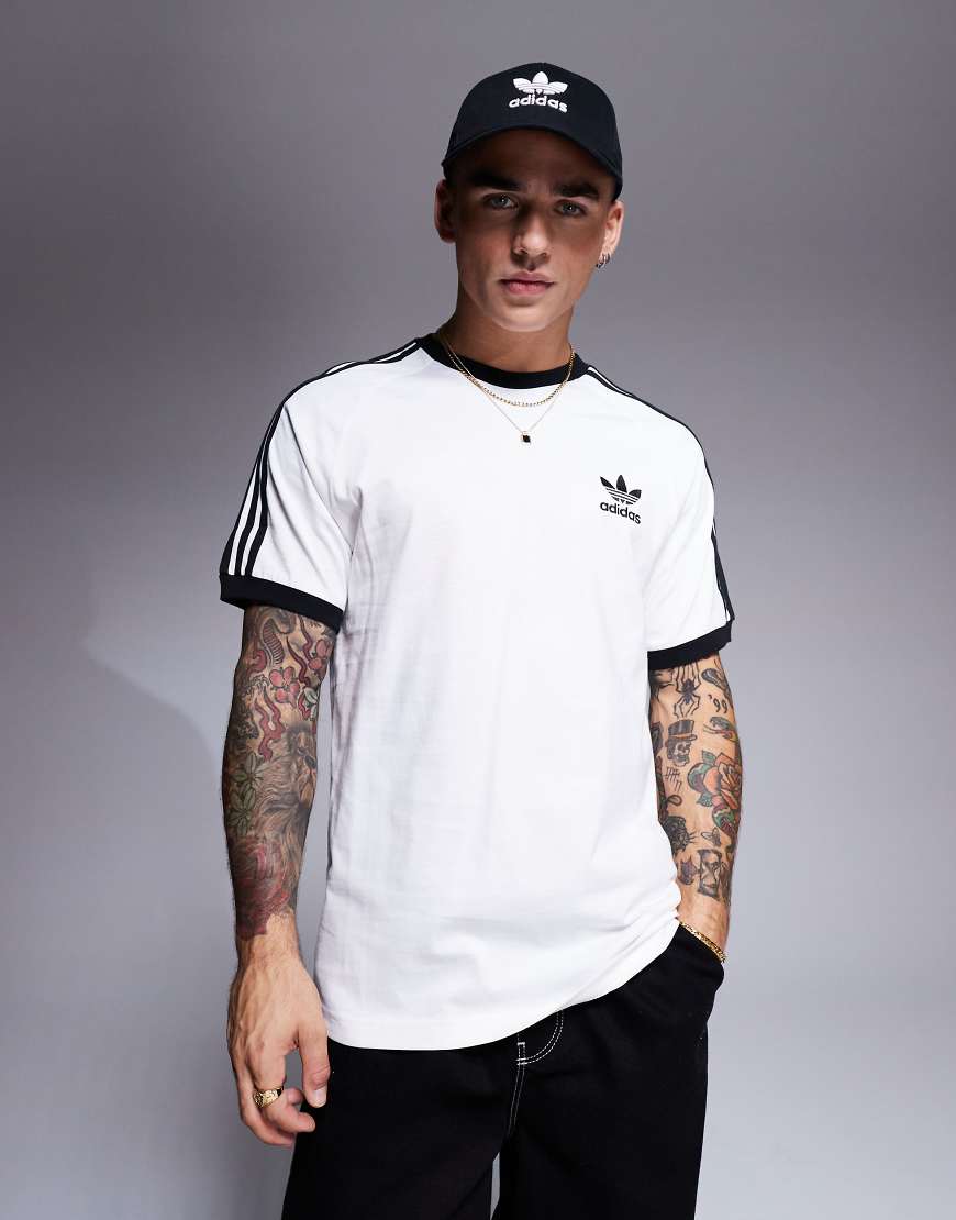 adidas Originals - Weißes Ringer-T-Shirt mit 3 Streifen adidas Originals - Weißes Ringer-T-Shirt mit 3 Streifen von adidas Originals