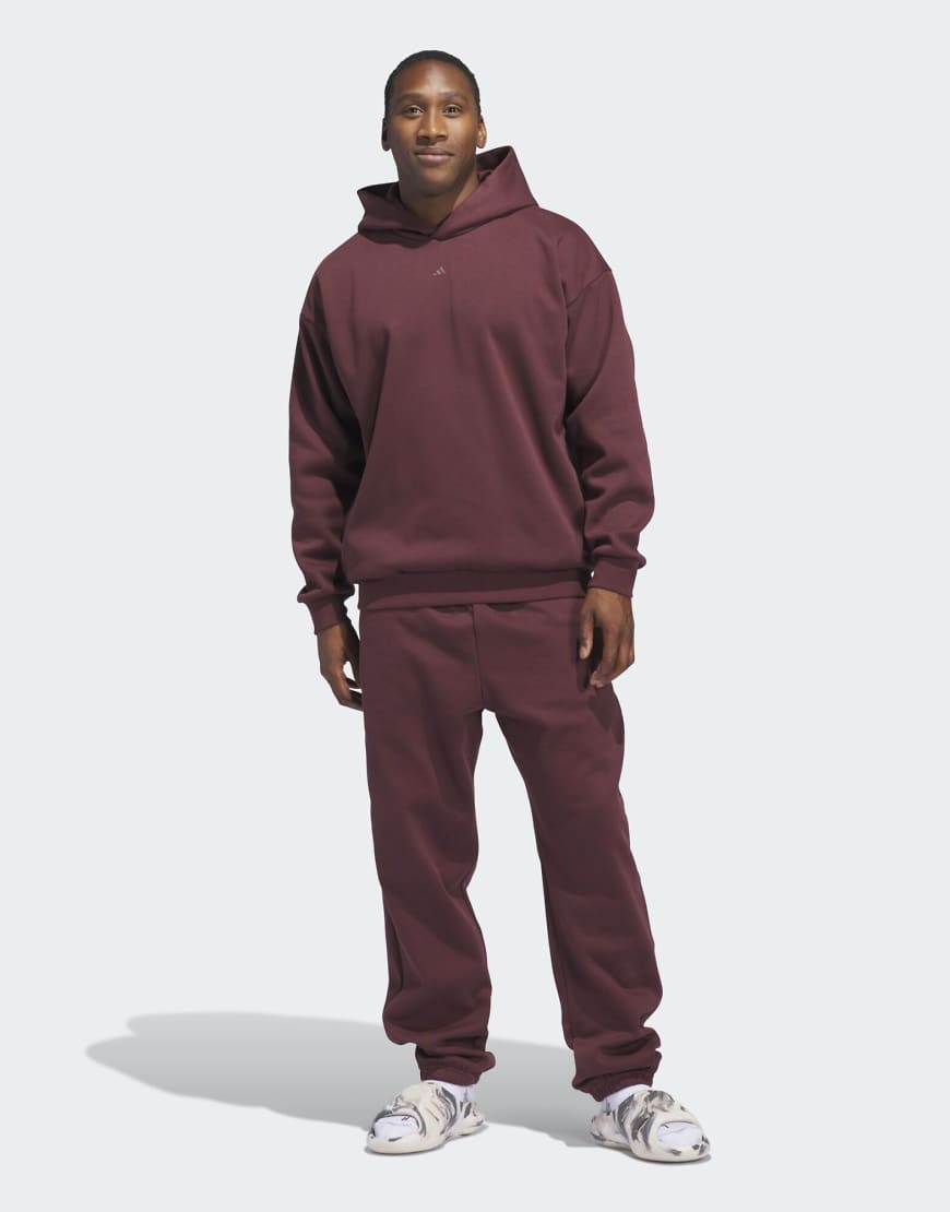 adidas Performance - Adidas Basketball - Unisex-Kapuzenpullover aus Fleece in Aurora Ruby und Braun-Rot von adidas performance