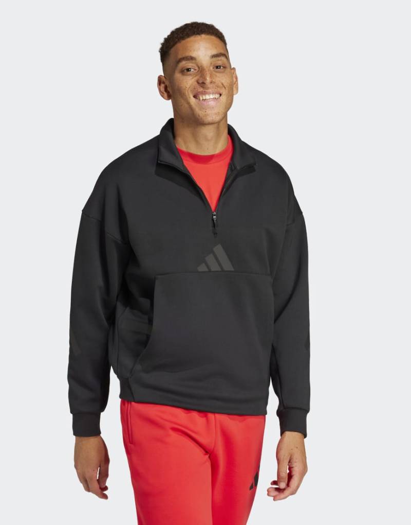 adidas Performance - Adidas Z. N.E. - Sweatshirt in Schwarz mit kurzem Reißverschluss adidas Performance - Adidas Z. N.E. - Sweatshirt in Schwarz mit kurzem Reißverschluss von adidas performance