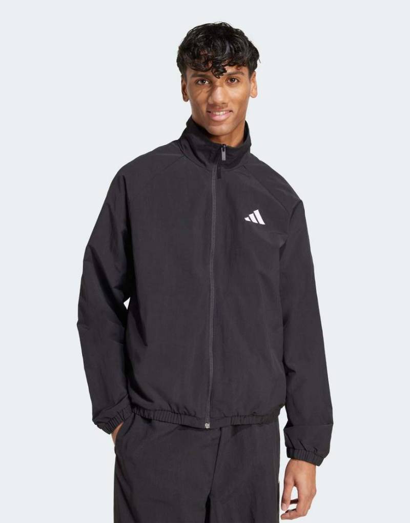 adidas Performance - Essential - Windjacke in Schwarz mit kleinem Logo in Weiß von adidas performance