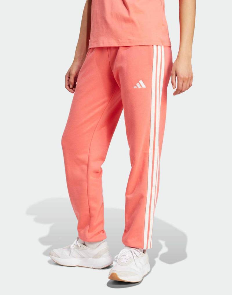 adidas Performance - Essentials - Hose in Semi Turbo/Weiß aus French Terry mit Bündchen und den 3 Streifen-Rot von adidas performance
