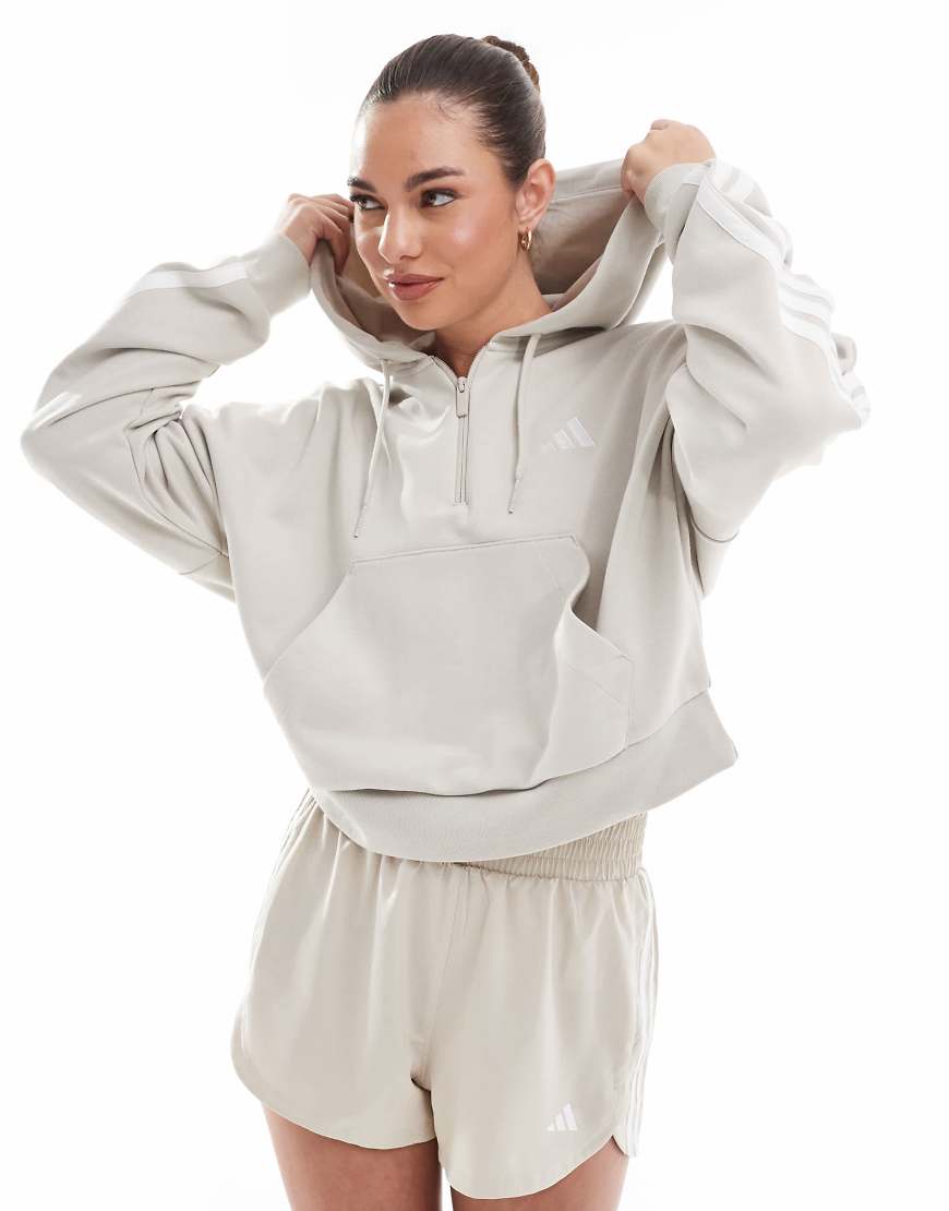 adidas Performance - Essentials - Kapuzenpullover aus French Terry in Grau mit kurzem Reißverschluss und den drei Streifen von adidas performance
