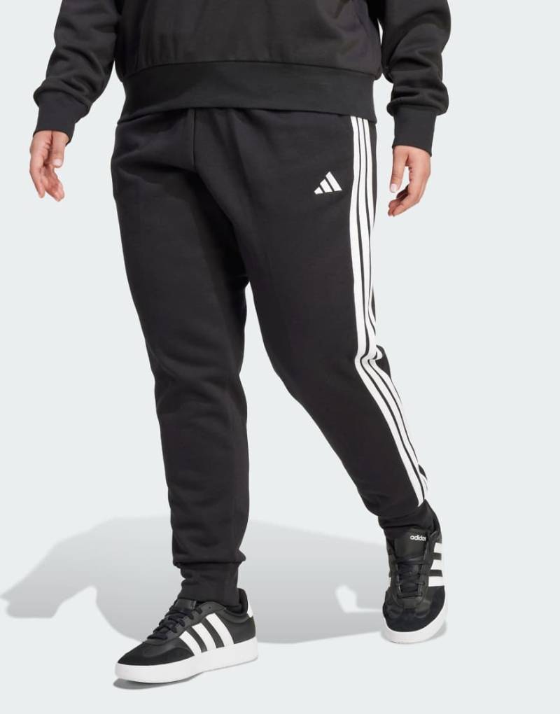 adidas Performance - Essentials - Plus-Size-Hose aus Fleece in Schwarz/Weiß mit den drei Streifen von adidas performance