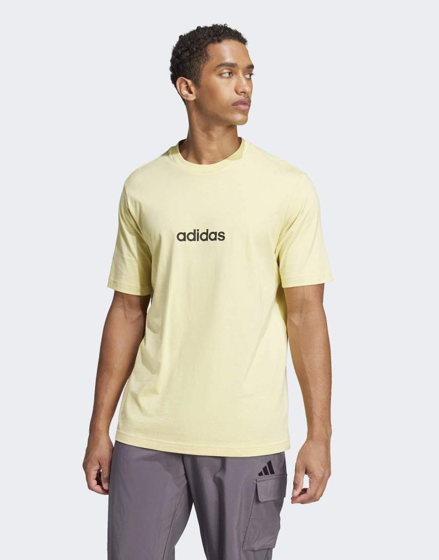 adidas Performance - Essentials - T-Shirt aus Single-Jersey in Pudergelb / Schwarz mit linearem Detail von adidas performance