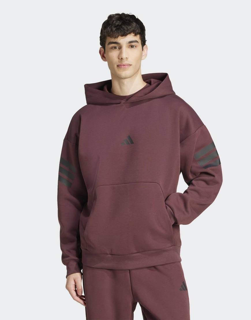 adidas Performance - Future Icons - Kapuzenpullover in Aurora Ruby / Braun mit Tasche und den 3 Streifen-Rot von adidas performance
