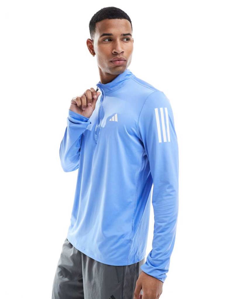 adidas Running - Own The Run - Oberteil in Blue Fusion mit kurzem Reißverschluss-Blau von adidas performance