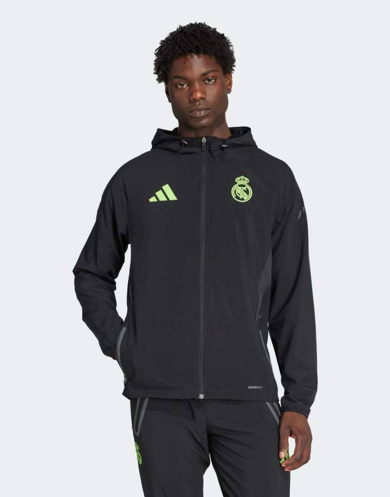 adidas Performance - Real Madrid Tiro 25 Pro Vis - Funktionale Auswärtsspiel-Jacke in Schwarz/Lucid Lemon adidas Performance - Real Madrid Tiro 25 Pro Vis - Funktionale Auswärtsspiel-Jacke in Schwarz/Lucid Lemon von adidas performance
