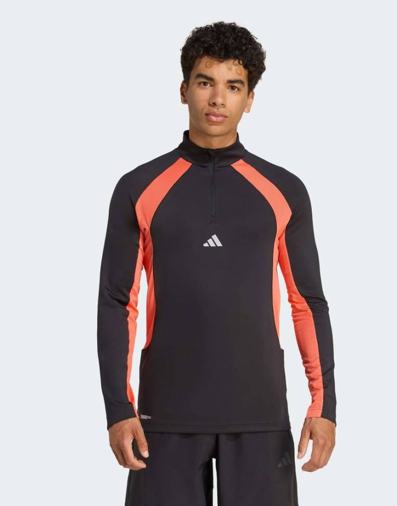 adidas Performance - Tech Apparel - Oberteil in Schwarz/Easy Coral mit kurzem Reißverschluss von adidas performance