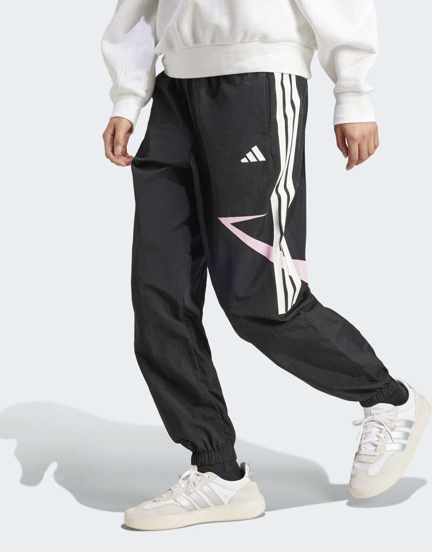 adidas Performance - Tiro Cut - Hosen in Schwarz / True Pink mit Color-Block-Design, den 3 Streifen und Bündchen von adidas performance