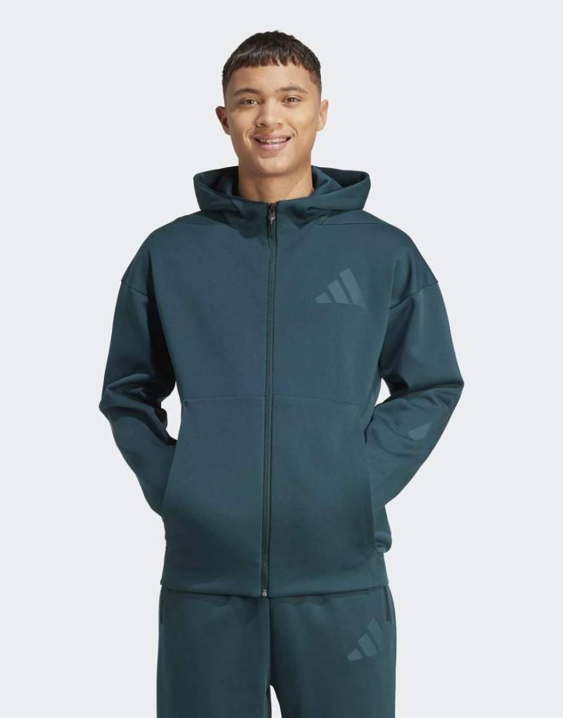 adidas Performance - Z. N.E. - Trainingsjacke in Aurora Ivy mit Kapuze und Reißverschluss-Grün von adidas performance