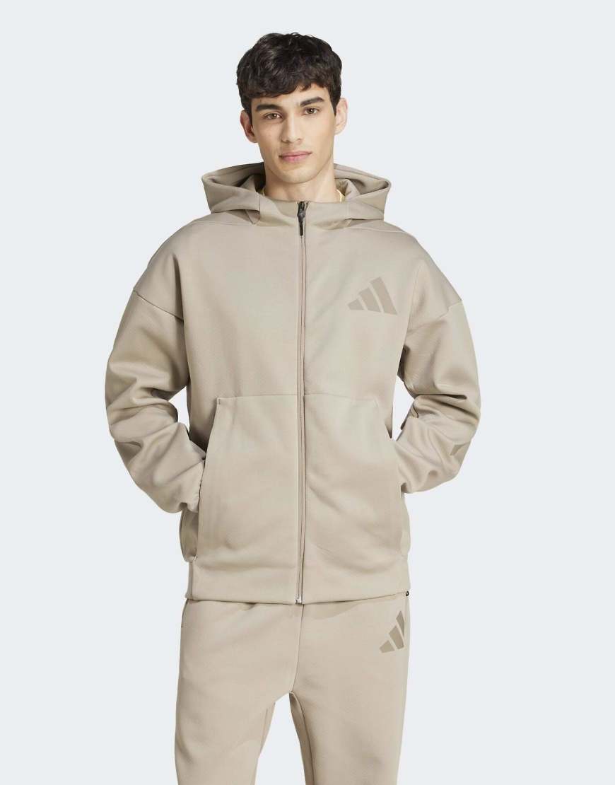 adidas Performance - Z. N.E. - Trainingsjacke in Kittbeige mit Reißverschluss und Kapuze-Grau von adidas performance