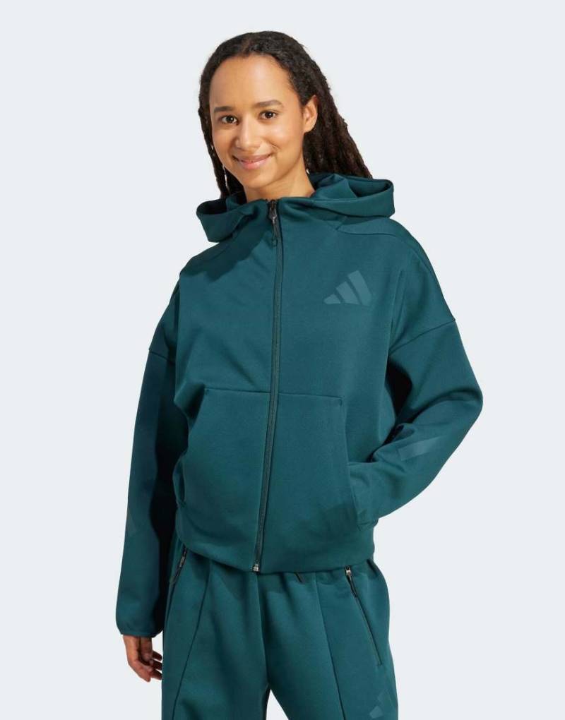 adidas Performance - adidas Z. N.E. - Kapuzenjacke in Aurora Ivy mit Reißverschluss-Grün von adidas performance