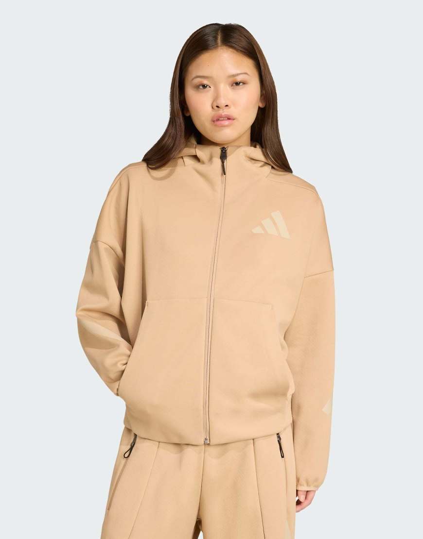 adidas Performance - adidas Z. N.E. - Kapuzenjacke in warmem Sandbeige mit Reißverschluss-Braun adidas Performance - adidas Z. N.E. - Kapuzenjacke in warmem Sandbeige mit Reißverschluss-Braun von adidas performance