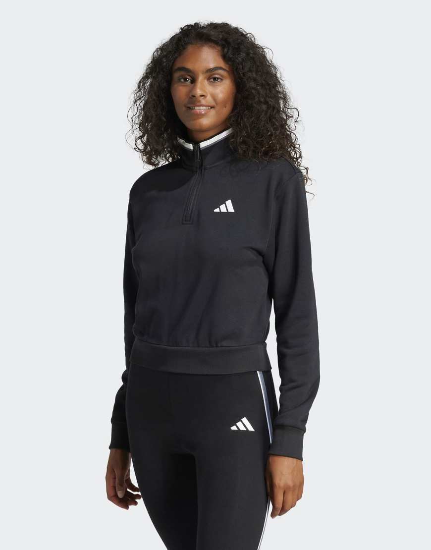 adidas performance - Essentials - Cropped-Trainingsjacke aus French Terry in Schwarz mit Farbakzent und kurzem Reißverschluss adidas performance - Essentials - Cropped-Trainingsjacke aus French Terry in Schwarz mit Farbakzent und kurzem Reißverschluss von adidas performance