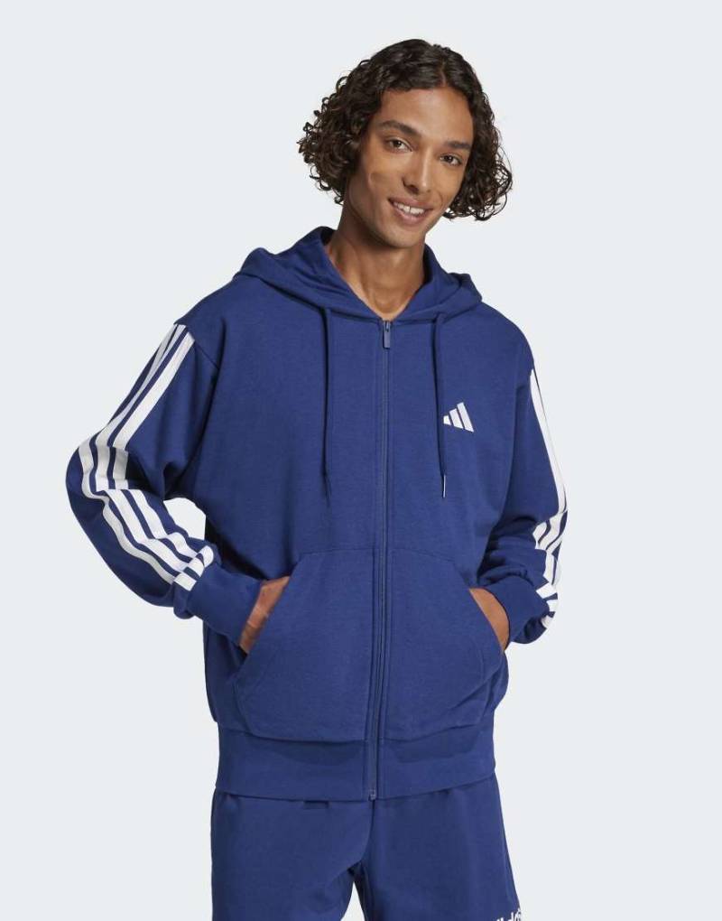 adidas performance - Essentials - Kapuzenjacke aus French Terry in Dunkelblau / Weiß mit den drei Streifen von adidas performance