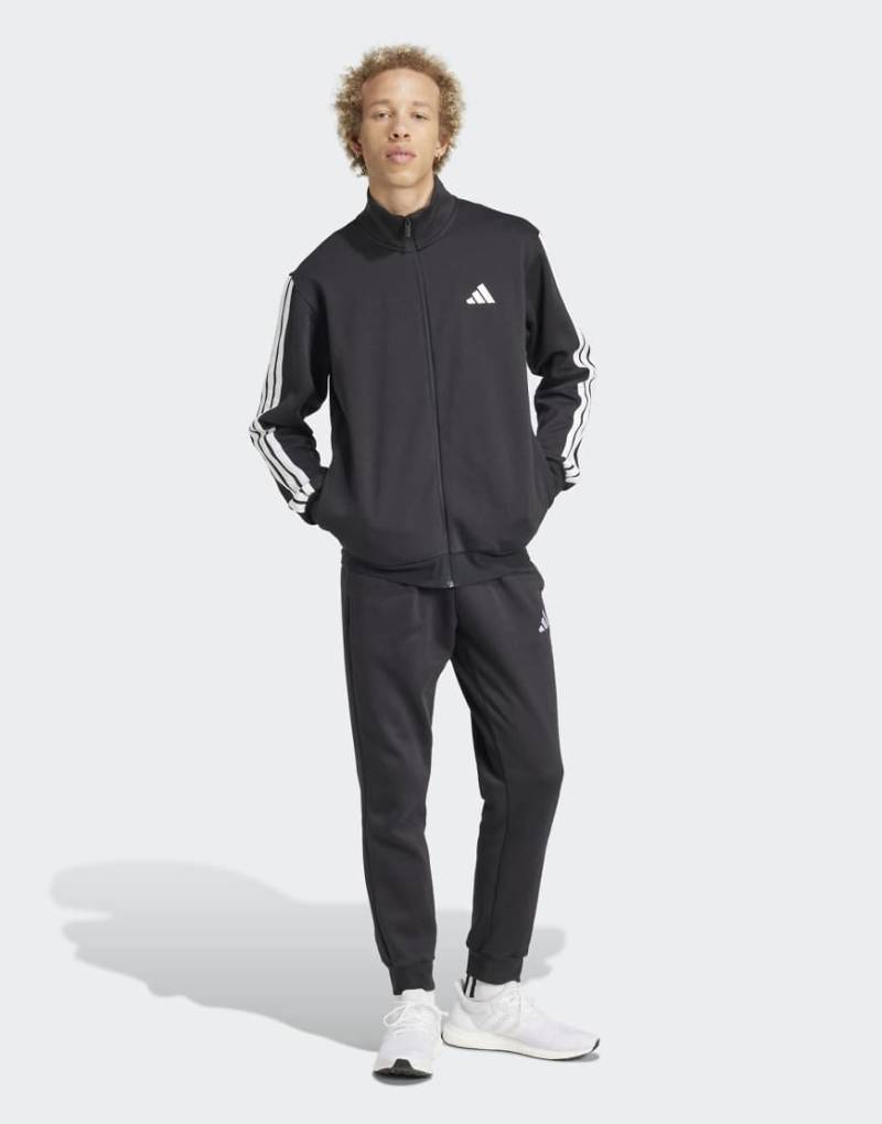 adidas performance - Sportswear - Basic-Trainingsanzug aus Fleece in Schwarz mit den drei Streifen von adidas performance