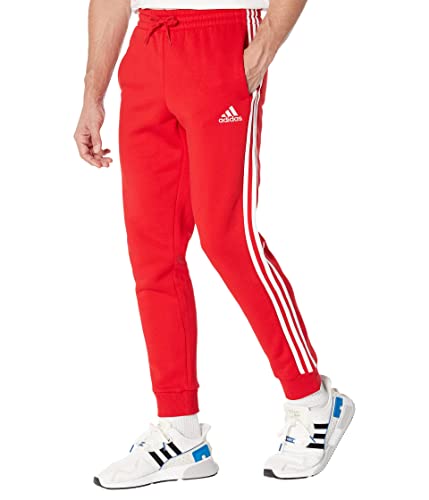 adidas Herren Essentials Fleece Tapered Cuff 3-Streifen Hose, Scarlet/White, X-Groß von adidas