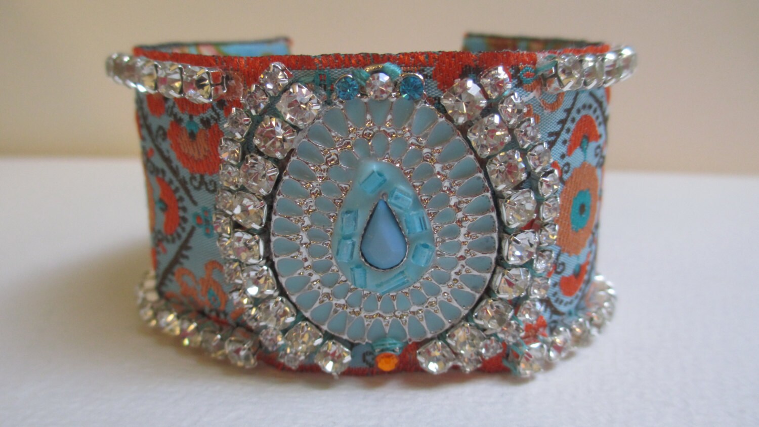 Clearancecuff Armband Aqua Orange Strass Satin Stoffband Clearancecuff Armband Aqua Orange Strass Satin Stoffband von audreymivey