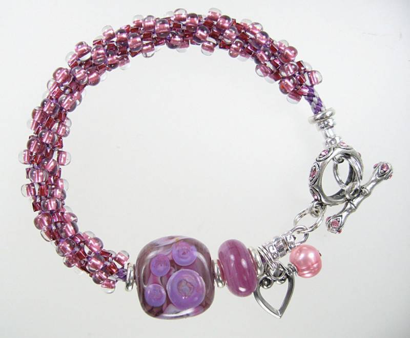 Handgefertigtes Pinkes Kumihimo Perlenarmband Mit Lampwork Perlen Handgefertigtes Pinkes Kumihimo Perlenarmband Mit Lampwork Perlen von boldenka