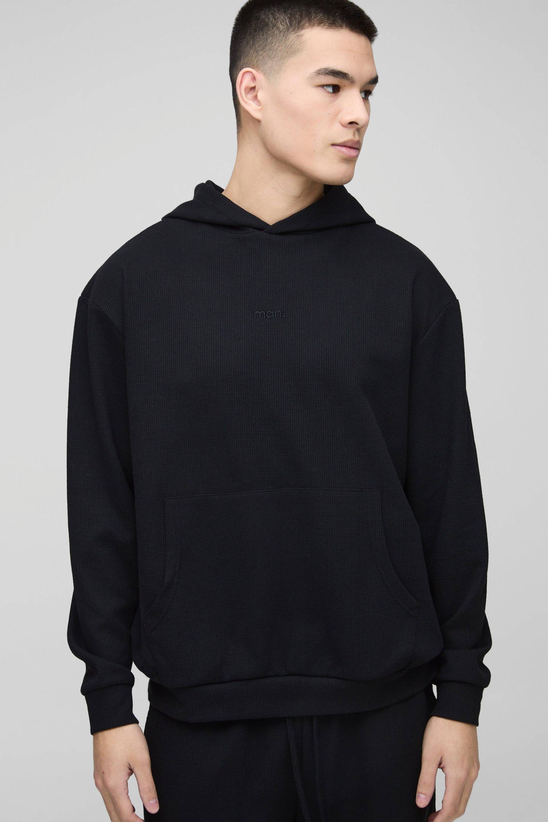 Oversize Hoodie in Waffeloptik mit Man-Stickerei - Schwarz - M, Schwarz von boohooman