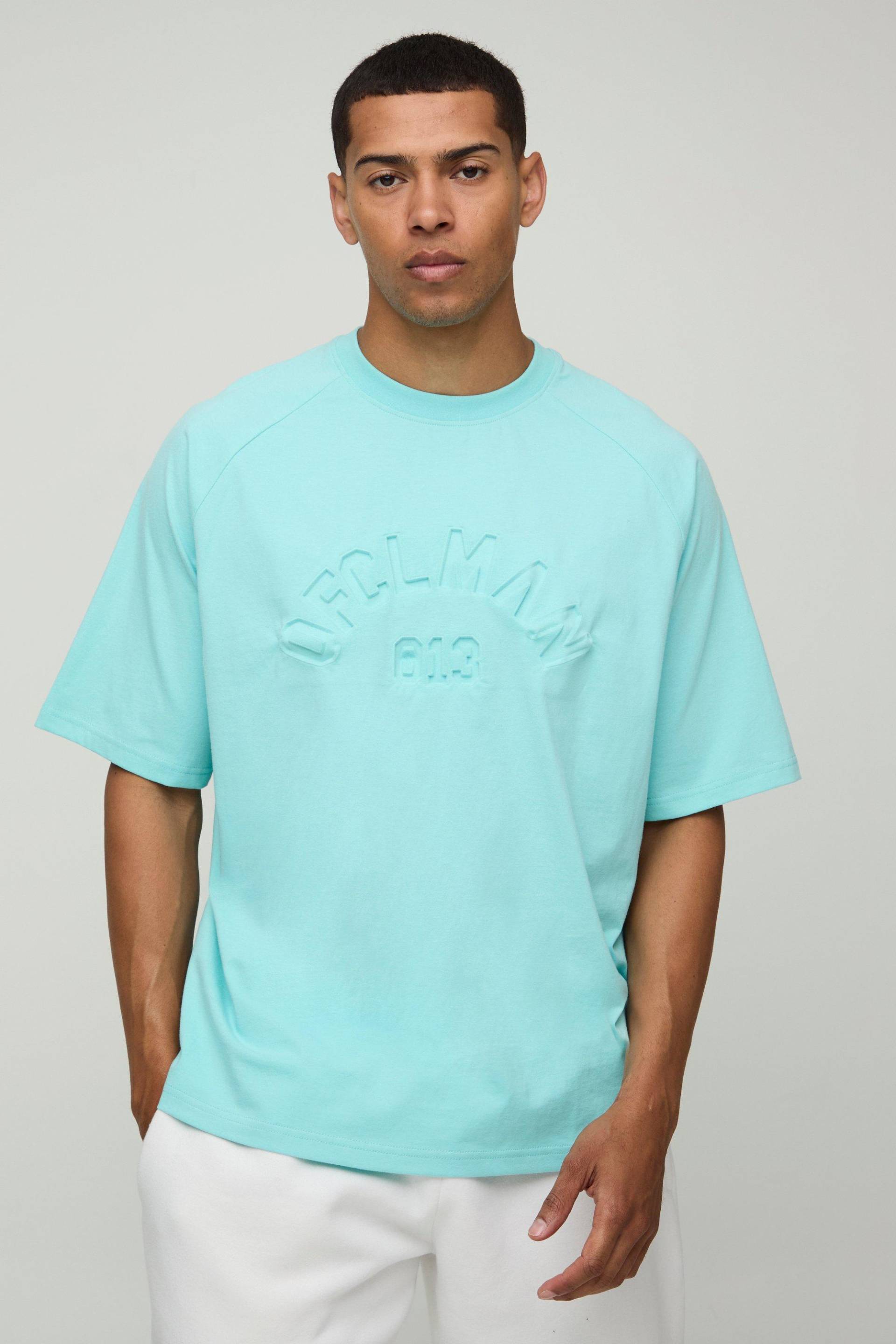 Oversize Raglan T-Shirt mit Official Man Print - Blau - M, Blau von boohooman
