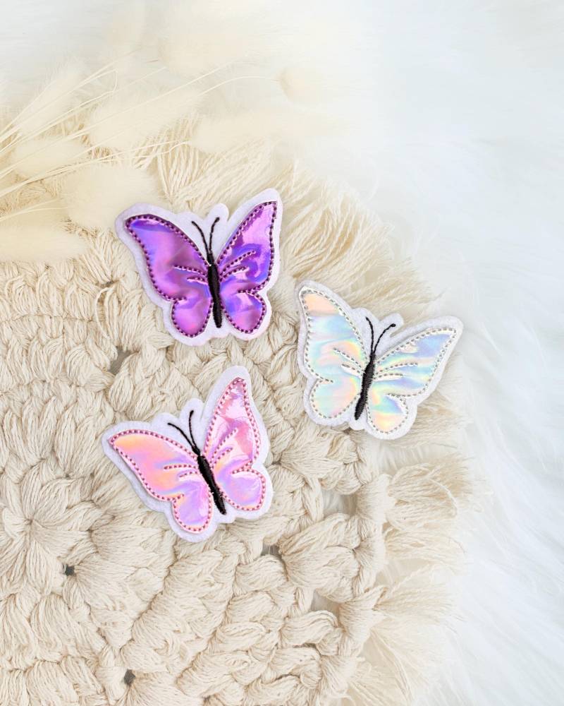 Schmetterling Aufnäher | Patch Applikation Irisierende Schimmernde Kunstleder Schmetterlinge Regenbogenfarbe Glitzer Rosa Lila Violett Schmetterling Aufnäher | Patch Applikation Irisierende Schimmernde Kunstleder Schmetterlinge Regenbogenfarbe Glitzer Rosa Lila Violett von designxmina