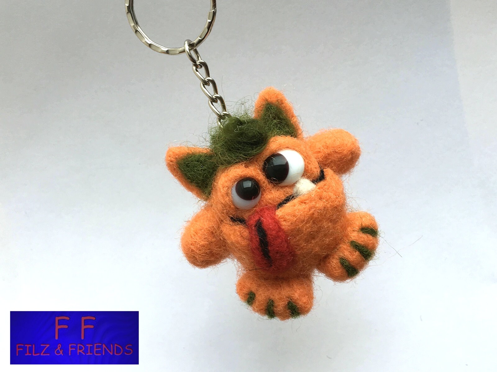 Monster Schlüsselanhänger Grünhaariger Orangenbeisser Monster Schlüsselanhänger Grünhaariger Orangenbeisser von filzundfriends