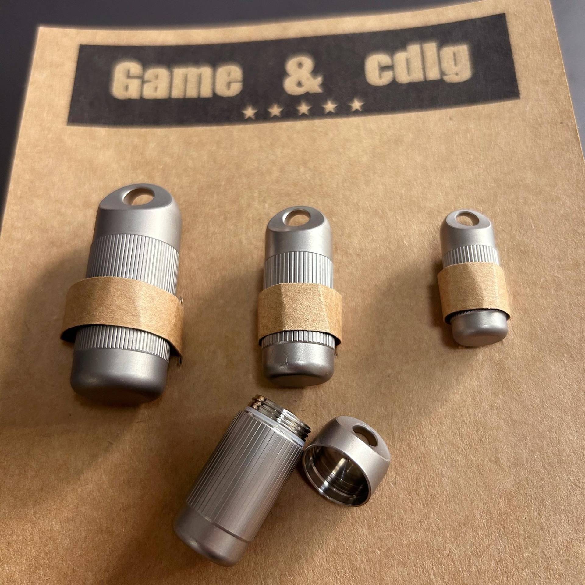 Three Sizes Of Titanium Alloy Waterproof Pill Boxes, High-Quality Keychain Pendants Three Sizes Of Titanium Alloy Waterproof Pill Boxes, High-Quality Keychain Pendants von gamecdlg