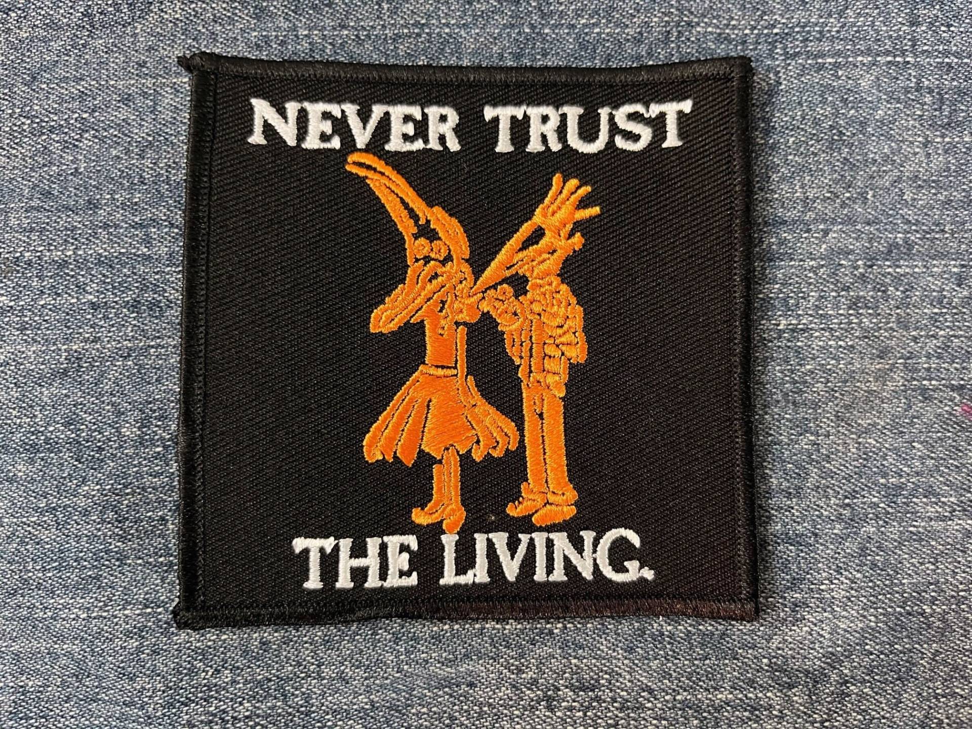 Never Trust The Living Patch von inkedupmerch