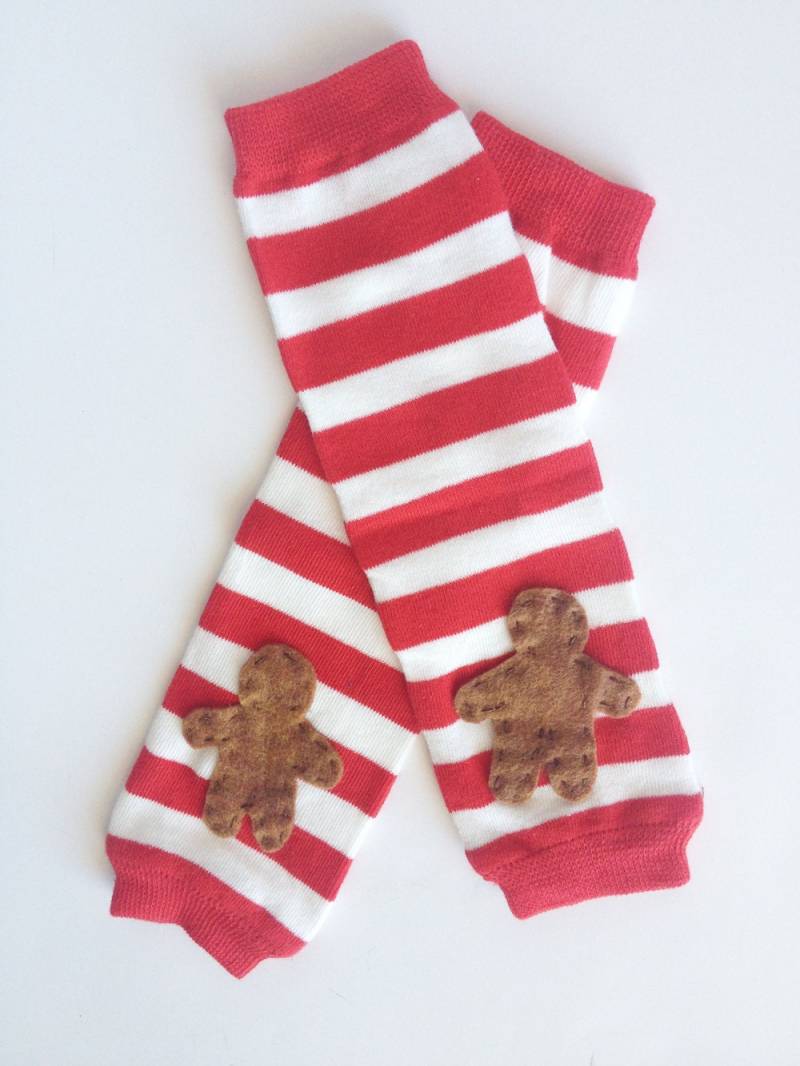 Weihnachten-Stulpen, Gingerbread Man Auf Rot Und Weiß Gestreiften Baby Stulpen Weihnachten-Stulpen, Gingerbread Man Auf Rot Und Weiß Gestreiften Baby Stulpen von kakabaka