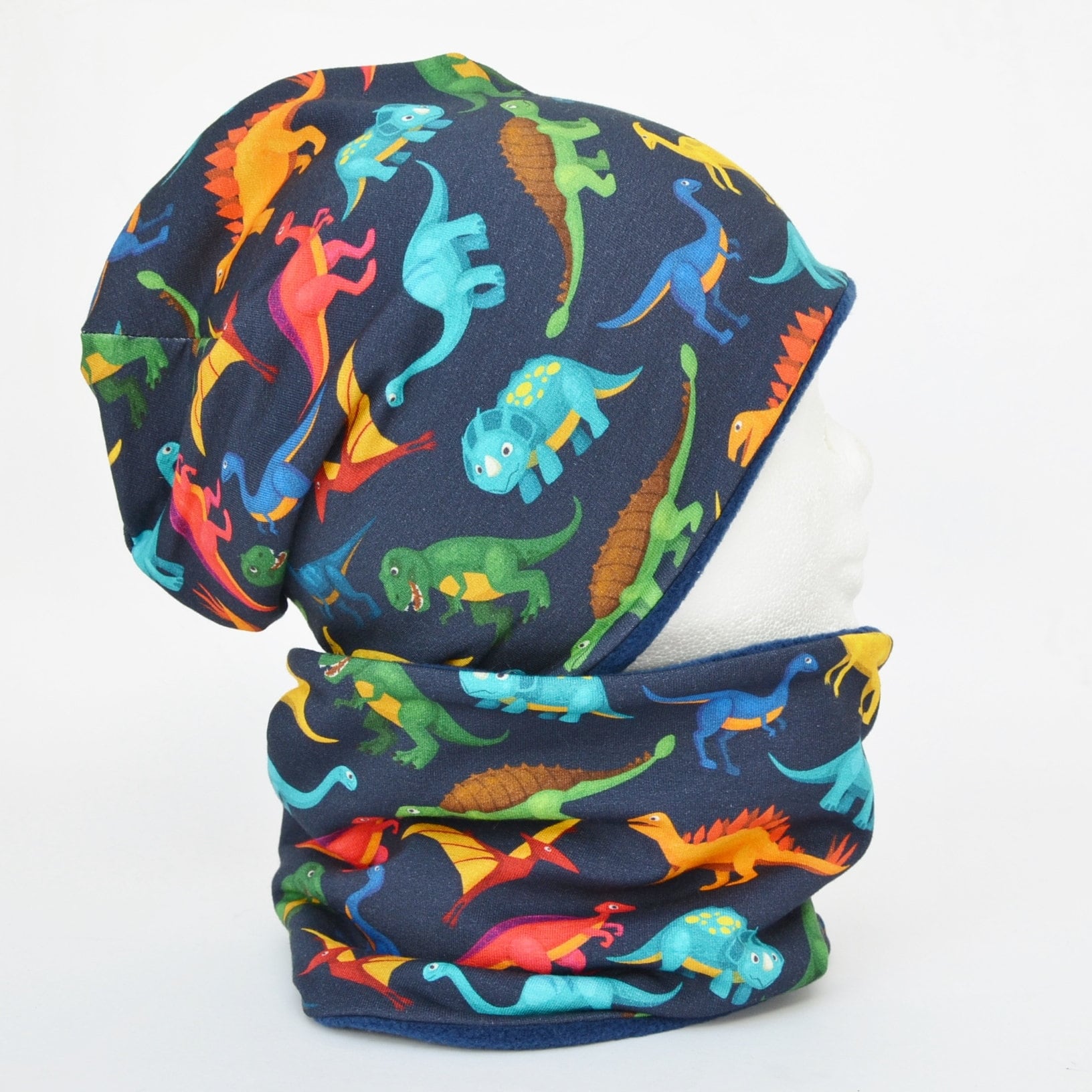 Wende Loop Schal & Mütze Set | Dinos Bunt Rot Gelb Grün/Uni Blau Junge Für 4 - 5 6 7 8 Jährige Jungs Boy Wende Loop Schal & Mütze Set | Dinos Bunt Rot Gelb Grün/Uni Blau Junge Für 4 - 5 6 7 8 Jährige Jungs Boy von lamaika