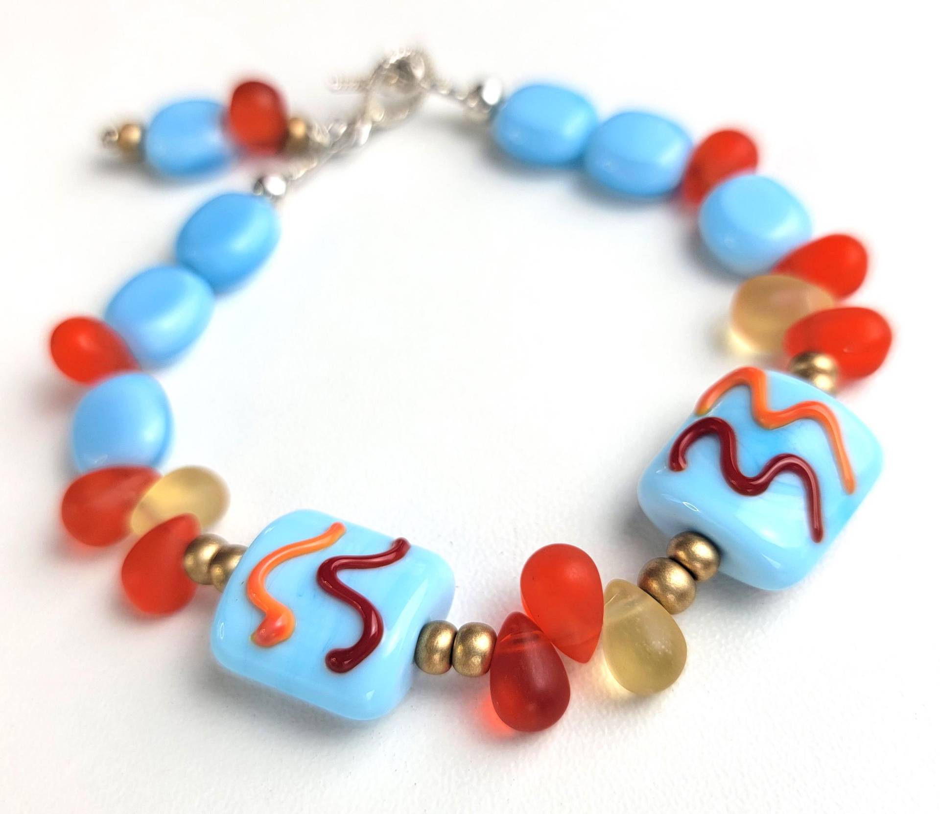 Handgefertigtes Lampwork Perlenarmband Aus Orange, Blau Und Sterlingsilber Handgefertigtes Lampwork Perlenarmband Aus Orange, Blau Und Sterlingsilber von o8sis