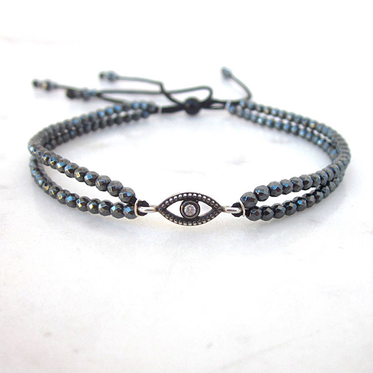 Hämatit Evil Eye Armband Sterling Silber Cz Amulett Hämatit Evil Eye Armband Sterling Silber Cz Amulett von pieceofART