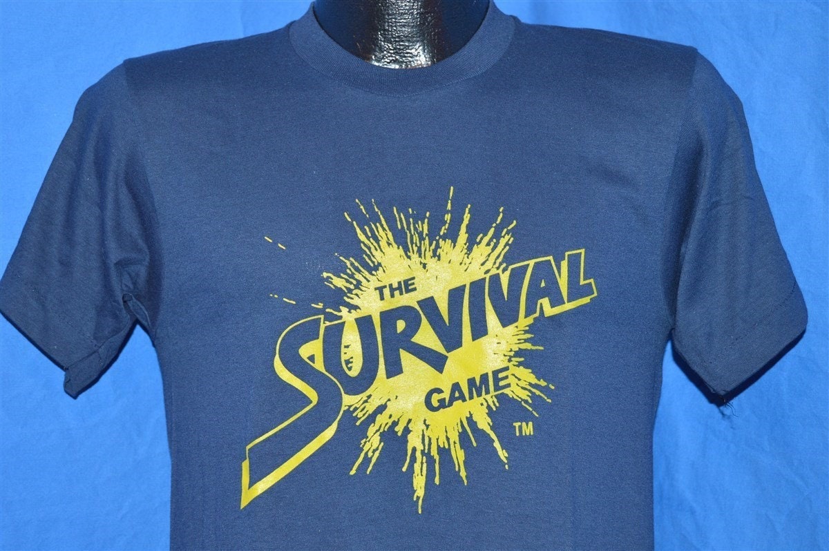 80Er Jahre The Survival Game Paintball Splatter Farbe T-Shirt Klein 80Er Jahre The Survival Game Paintball Splatter Farbe T-Shirt Klein von thecaptainsvintage