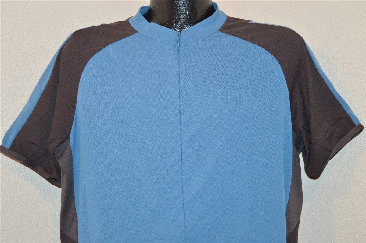 90Er Jahre Rei Blau Grau Jersey T-Shirt Extra Large 90Er Jahre Rei Blau Grau Jersey T-Shirt Extra Large von thecaptainsvintage