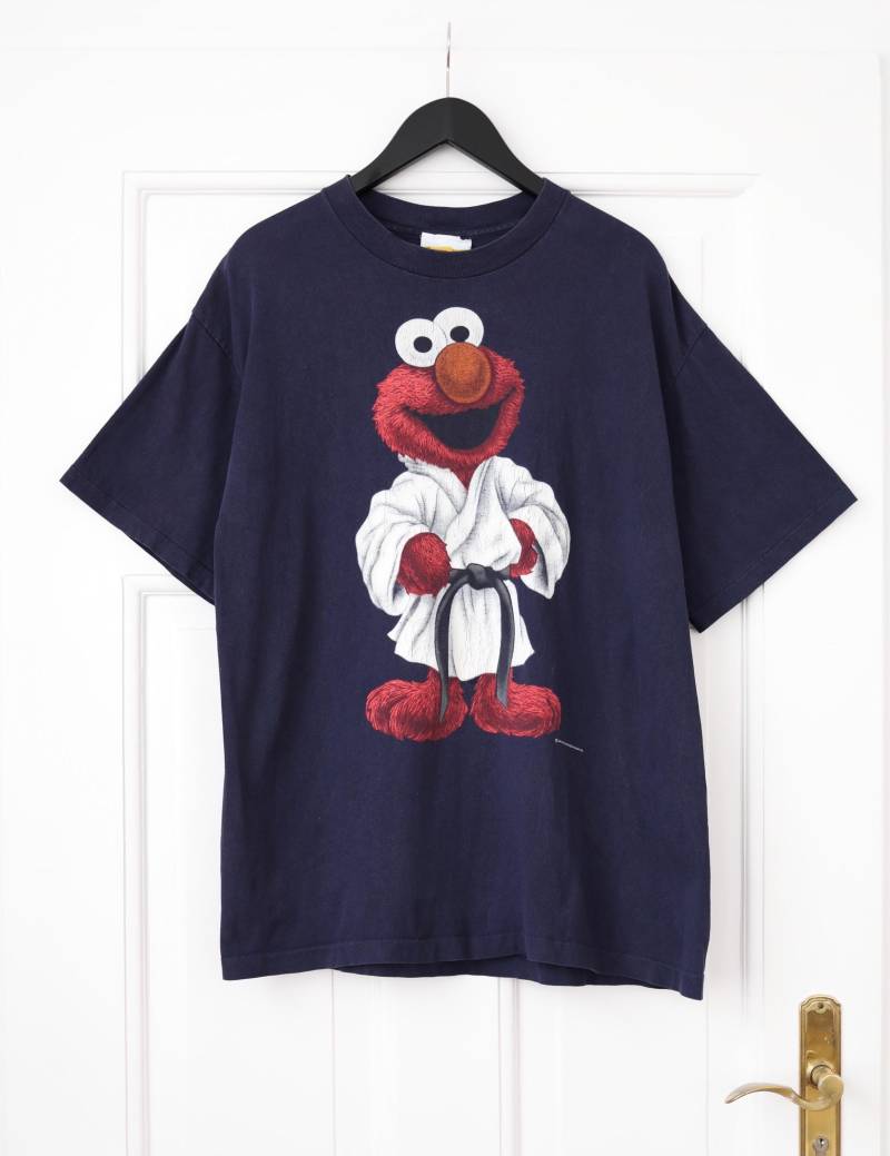 Elmo Karste Vintage Shirt Sesamestreet Sesamstraße 90Er Graphic 90S Elmo Karste Vintage Shirt Sesamestreet Sesamstraße 90Er Graphic 90S von thisisjkvintage