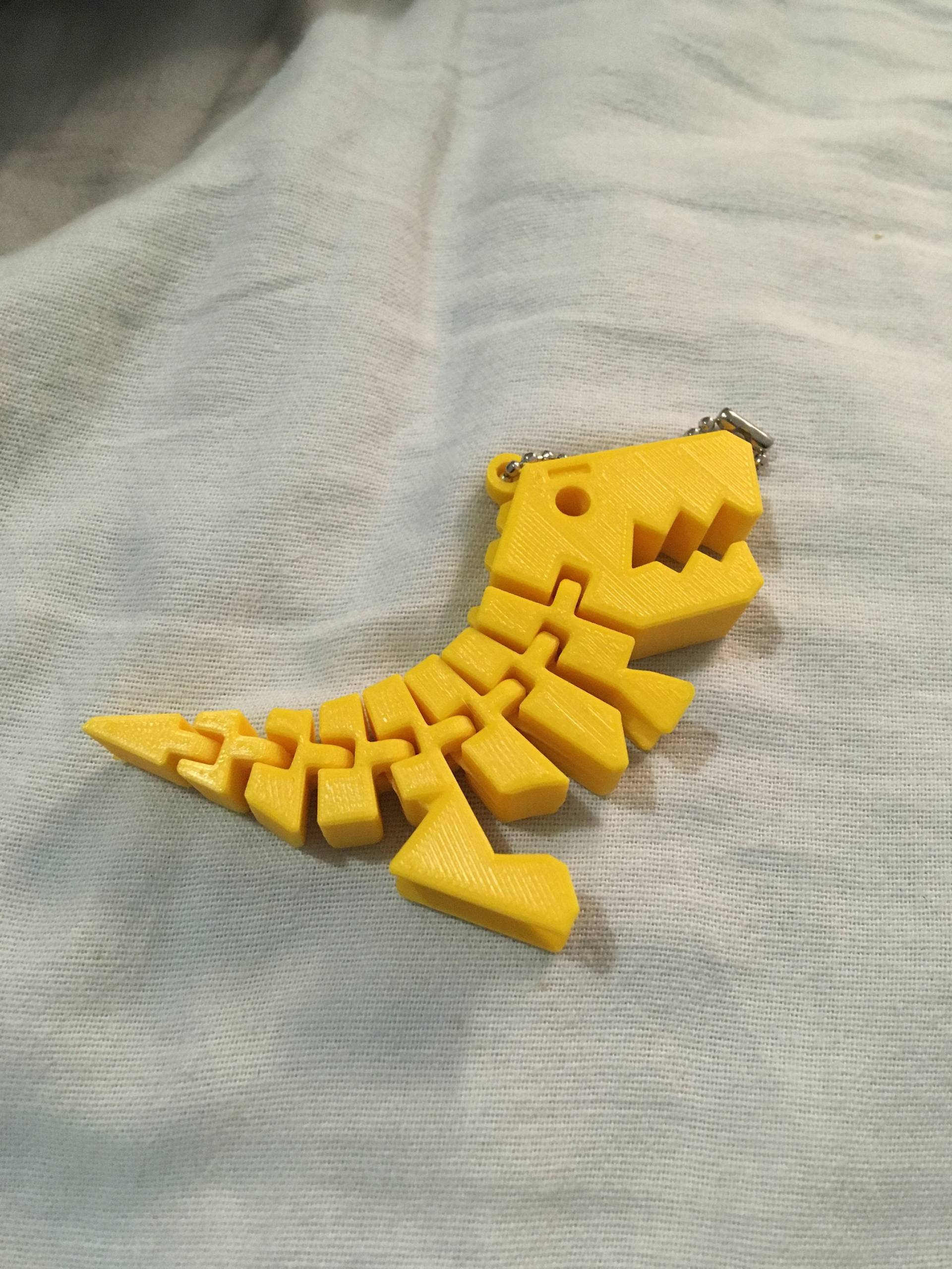 3D Gedruckter Dino Schlüsselanhänger 3D Gedruckter Dino Schlüsselanhänger von threeDprintin